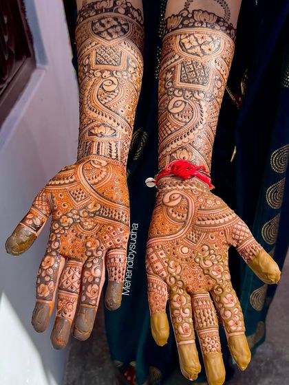 The beautiful stain of a full bridal mehendi, showcasing the deep orange and brown tones that develop from natural henna.