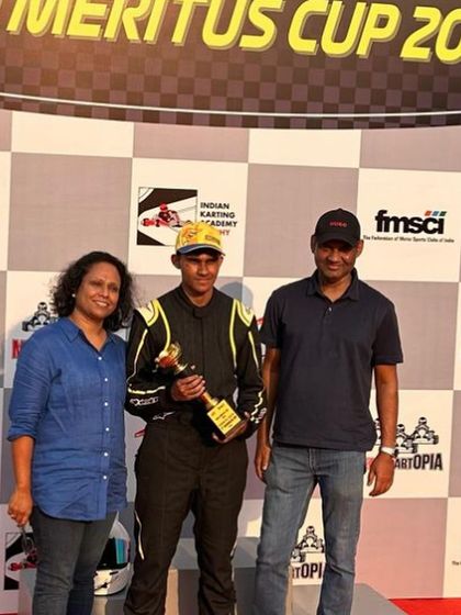 A driver celebrating his P2 trophy with his family.