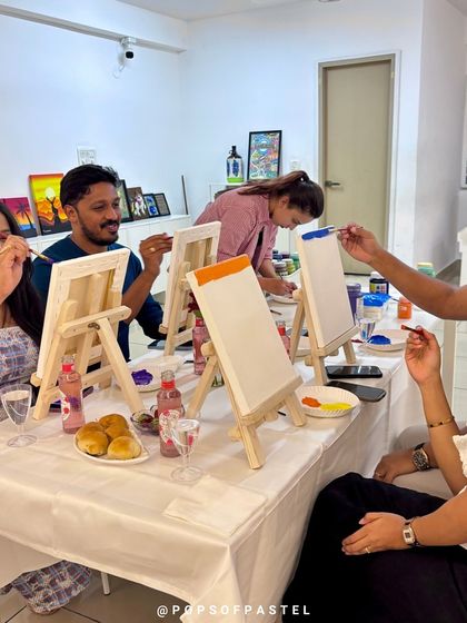 Laughter and creativity fill the room as couples paint together at our Valentine's workshop.
