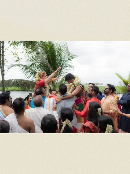 A celebratory moment where the groom is lifted by his family. My draping technique ensures the veshti stays secure, allowing the groom to fully participate in every joyful tradition.