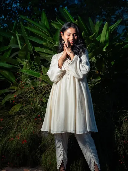 A sweet and serene portrait of Nayab Midha. The soft, natural makeup enhances her features without looking heavy, perfect for this sun-kissed shot.