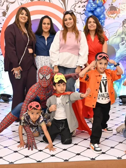 The birthday squad posing with Spider-Man. It's moments like these, full of friendship and fun, that make a birthday party truly special.