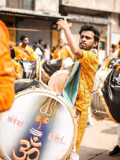 The color version, showing the dhol with 'Om' and 'Trishul' symbols.