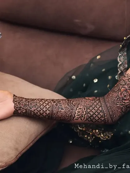 Another professional shot from the bridal henna session, capturing the moment of creation.
