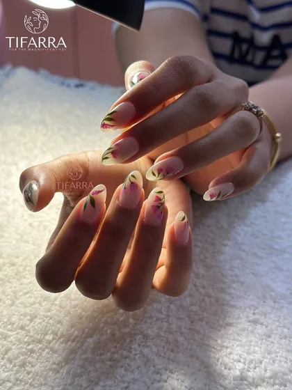 A beautifully lit shot of the tulip nail art, highlighting the soft colors and delicate brushwork.