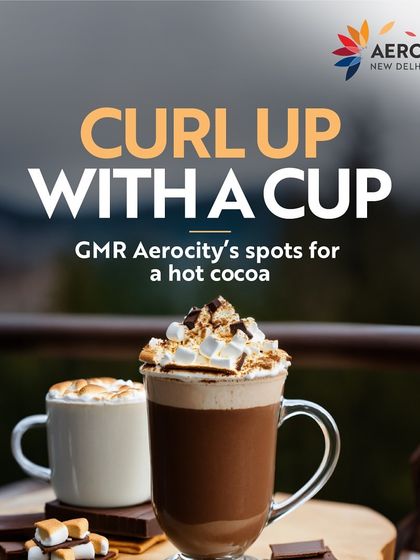 Curl up with a cup of hot cocoa this winter. This image, featuring two steaming mugs topped with marshmallows, showcases the cozy and comforting hot chocolate spots you can find here.