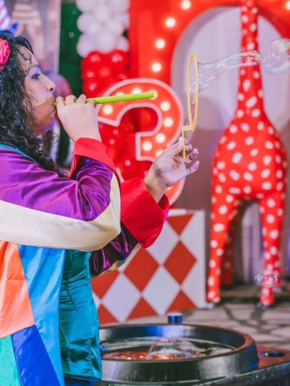 A bubble artist in a colorful costume adds to the festive circus atmosphere. The entertainment is always styled to perfectly match the event's theme, creating a cohesive and immersive experience.