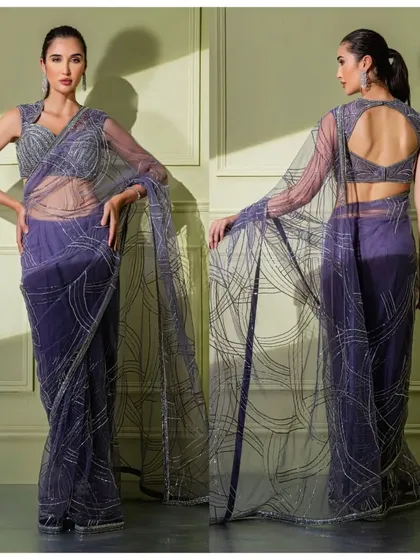 The full front and back view of the purple net saree, showcasing the dramatic, artistic embroidery and the keyhole back design.