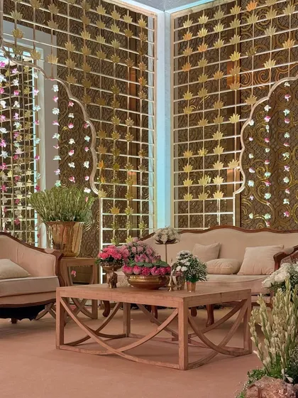 Another view of the plush seating area, where modern wooden furniture is paired with traditional golden backdrops, creating a unique fusion of styles.