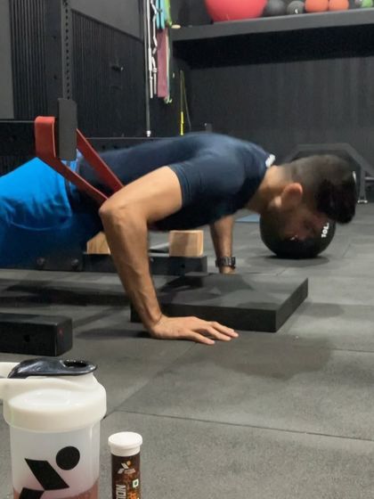 A close-up of a plyometric push-up. This drill trains the upper body to produce force rapidly, which is essential for powerful throws and hitting.