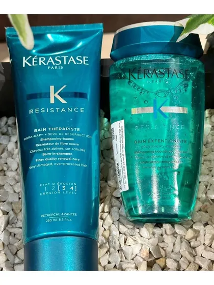 A shot of Kérastase Résistance and Extentioniste shampoos, ideal for strengthening damaged hair and promoting healthy growth.