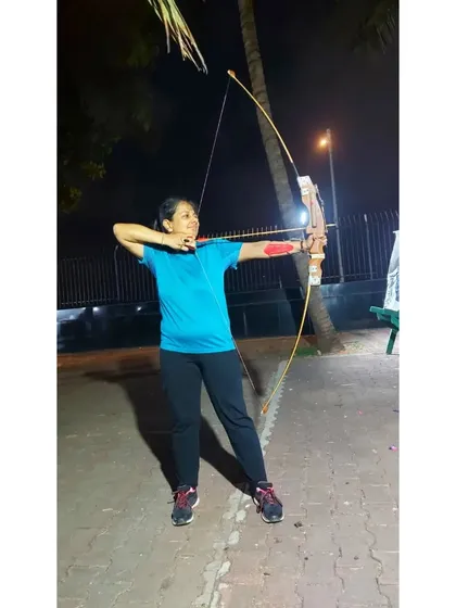 An adult student enjoying a night session. Archery is a great way to de-stress and focus after a long day.