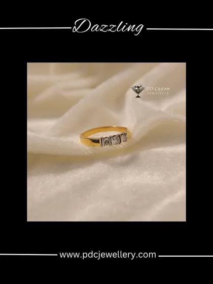 A dazzling three-stone diamond ring in 18kt gold. This classic design symbolizes the past, present, and future, making it a meaningful and beautiful choice.