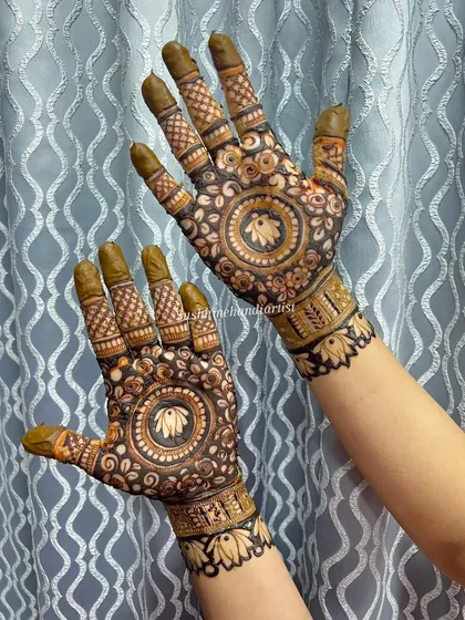 Another look at the lotus mandala design, this time with the henna paste still on. The dark paste promises a beautiful, rich stain.