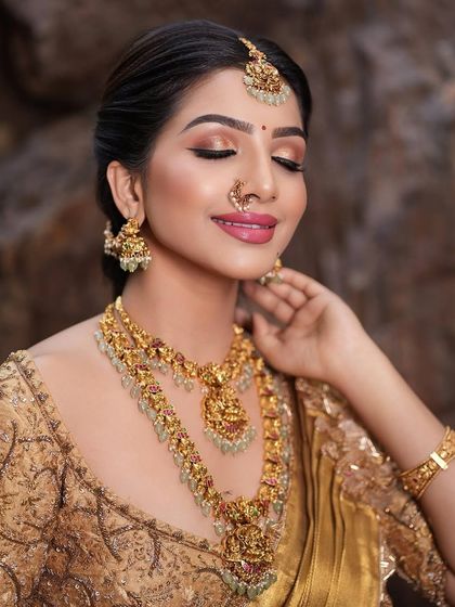 An eyes-closed shot to highlight the soft, shimmery eyeshadow and the flawless finish of the makeup.