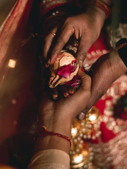 The Kanyadaan, a father's blessing. This photo captures the hands of the father and daughter during this deeply significant Hindu wedding ritual.