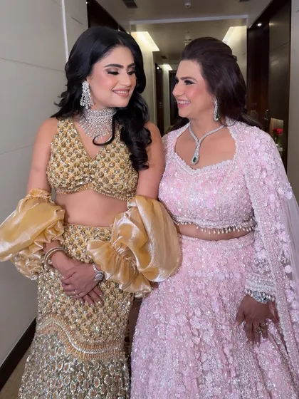 A beautiful moment between mother and daughter-in-law. Both ladies look stunning in their coordinated glam looks.