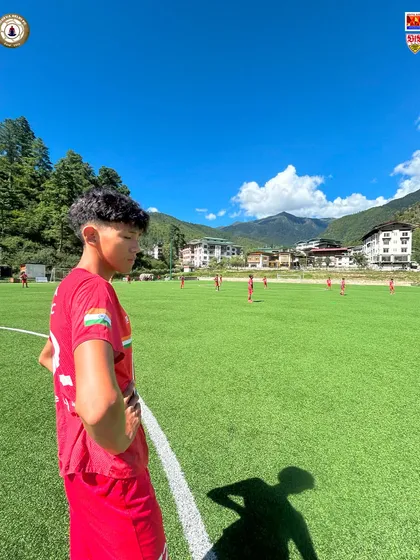 A player takes in the incredible scenery during a training session in Bhutan. These tours are not just about football; they are about broadening horizons and experiencing new cultures.