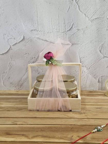 This simple and elegant Rakhi hamper features three jars of our gourmet treats in a wooden crate, perfect for a minimalist yet thoughtful gift.