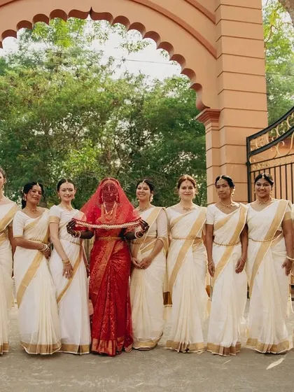 It was an honour to drape for this beautiful bride and her international bridesmaids for a traditional Kerala wedding. This shows my experience in handling large groups and creating a coordinated, elegant look for the entire bridal party.