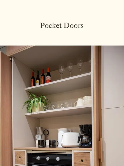 Pocket doors are a wonderfully practical solution for creating an appliance station. They keep your daily essentials hidden when not in use, helping to maintain a minimalist and uncluttered kitchen environment.