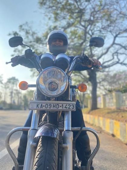 A graduate on the road, helmet on and ready to go. This is the freedom and independence our training provides.