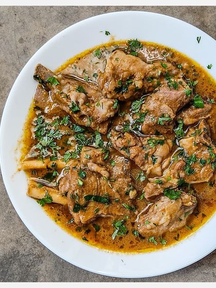 Another look at the Bannur Mutton Saaru, showing the tender, bone-in pieces of lamb.