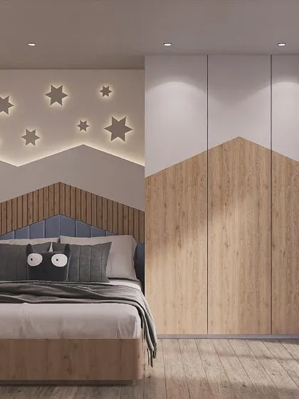 Designing for kids is all about sparking joy and imagination. This mountain-themed bedroom uses playful shapes and a starry night wall to create a magical space for dreaming and growing.