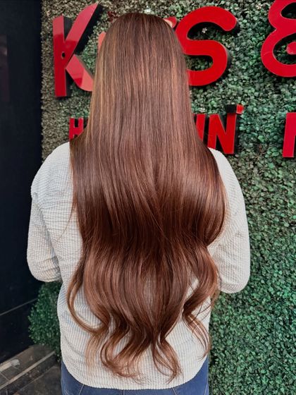A back view of this stunning brunette bridal look, showing off the length and the richness of the color.