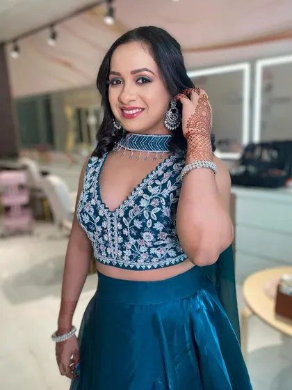 A happy client ready for a wedding celebration. Her smile says it all. This elegant look was created in my studio, ensuring she felt her absolute best.
