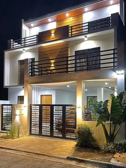 Night lighting is a crucial part of exterior architecture, and this design shows how we use it to enhance a home's features after dark. The strategically placed lights highlight the building's form, creating a warm and secure ambiance.