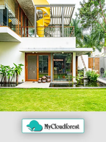 I designed this space to seamlessly blend modern architecture with the natural environment. The clean lines of the home are softened by a pristine lawn and a tranquil water feature, creating a private retreat that feels both sophisticated and serene.