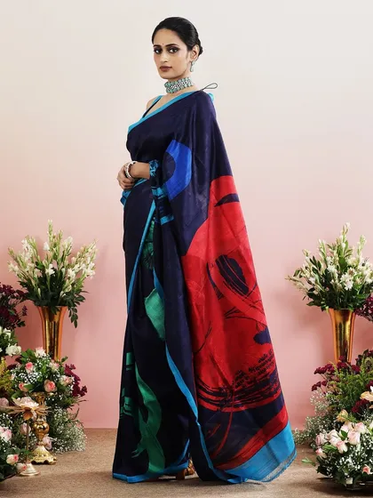 The full view of the abstract blue and red saree, a vibrant and contemporary choice for any festive event.