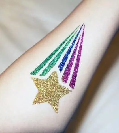 A shooting star with a rainbow glitter trail. This is a dynamic and colorful design that is very popular at birthday parties.