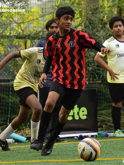 Dribbling with purpose. One of our U-15 players advancing the ball up the field during a competitive match.