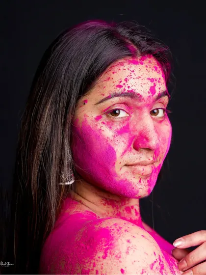 A serene portrait amidst the color chaos. This shot from our Holi series shows a calm and confident expression, proving that you can find beauty even in the mess.