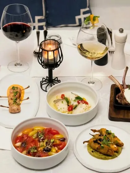A bright and elegant flat lay of our dishes, showing the variety and artistry of our Mediterranean menu.