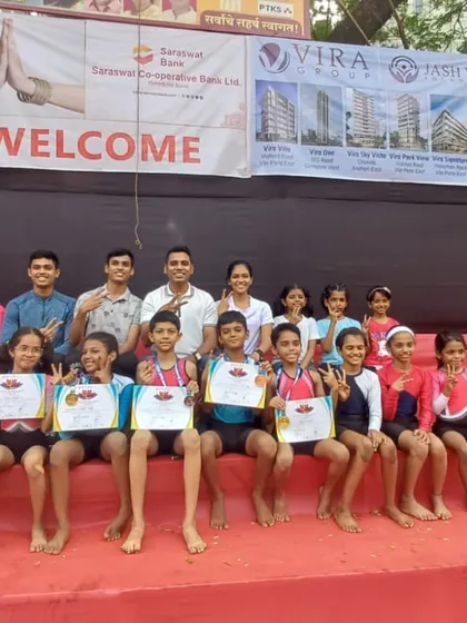 The victorious team. Our young athletes and coaches pose with their well-earned medals and certificates after a fantastic showing at the local Parle Mahotsav competition.