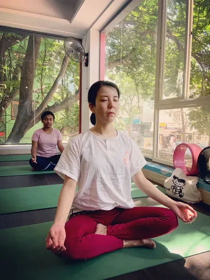 Turning inward. A student sits for meditation, demonstrating the importance of stillness in a complete yoga practice.
