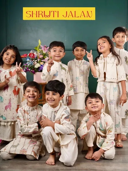 A happy group of children showcasing my playful animal-print collection. I designed these so that boys and girls can coordinate in a fun, modern way.