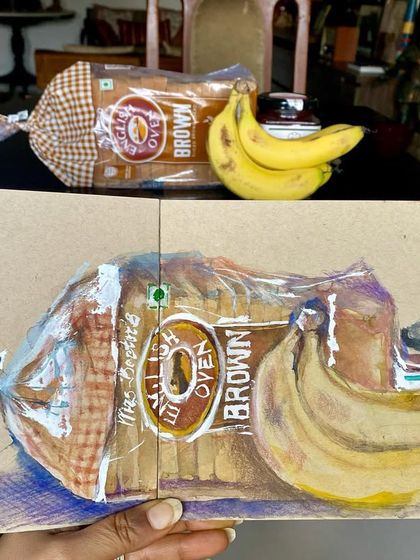 My Sunday morning looks like this: grabbing things from the breakfast table and sketching them. A mixed media still life of a loaf of bread, bananas, and jam on tanned paper.