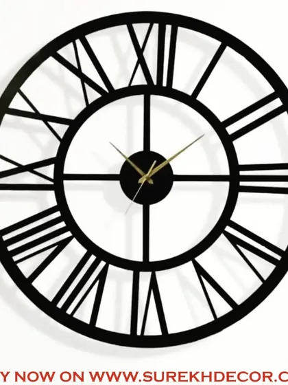 A close-up view of our classic vintage wall clock, highlighting the clean lines of the Roman numerals and the quality of the antique metal finish. This piece is available in multiple sizes to perfectly fit your space.