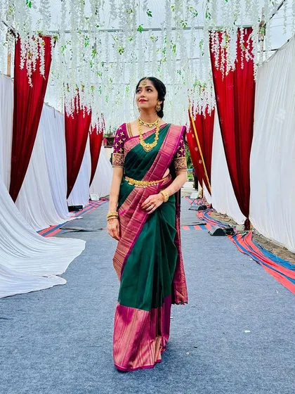 A graceful pose showing the full effect of the traditional styling for the groom's sister.