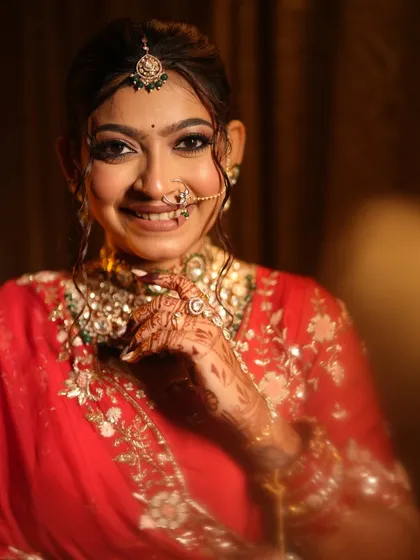 A bright, happy close-up of the bride, her smile lighting up the photo.