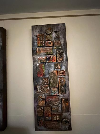 This is an abstract mixed-media piece with a rustic, industrial feel. I used various materials to build up layers of texture, creating a complex and serene artwork that invites closer inspection.