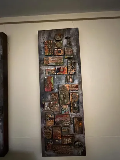 This is an abstract mixed-media piece with a rustic, industrial feel. I used various materials to build up layers of texture, creating a complex and serene artwork that invites closer inspection.