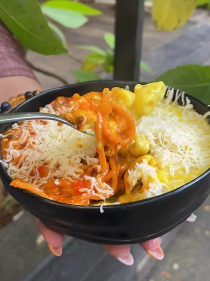 A spoonful of my Pasta & Pasta, showing the mix of red spaghetti and white macaroni. It’s a dish I created for those who love variety and can never pick just one favourite.