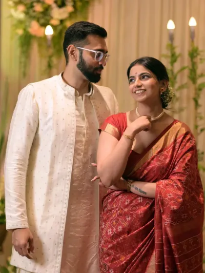 A lovely candid photo of the couple sharing a glance, capturing the natural chemistry between them during their Roka.