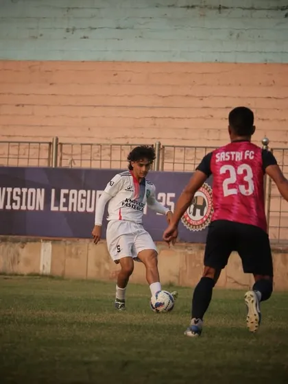 A tense moment from our first match, as our player shields the ball from the opposition.