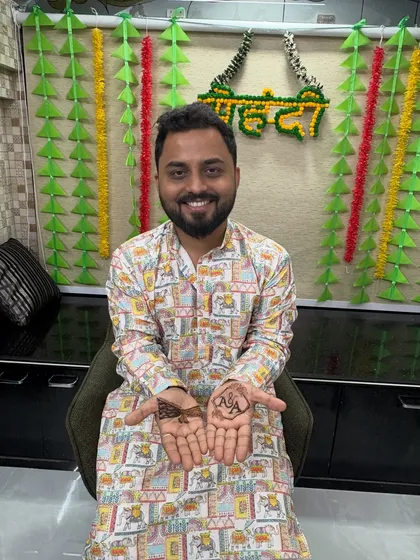 Look at that happy smile. This groom was so excited to show off his personalized mehendi. Capturing these moments of joy is just as important as the art itself.